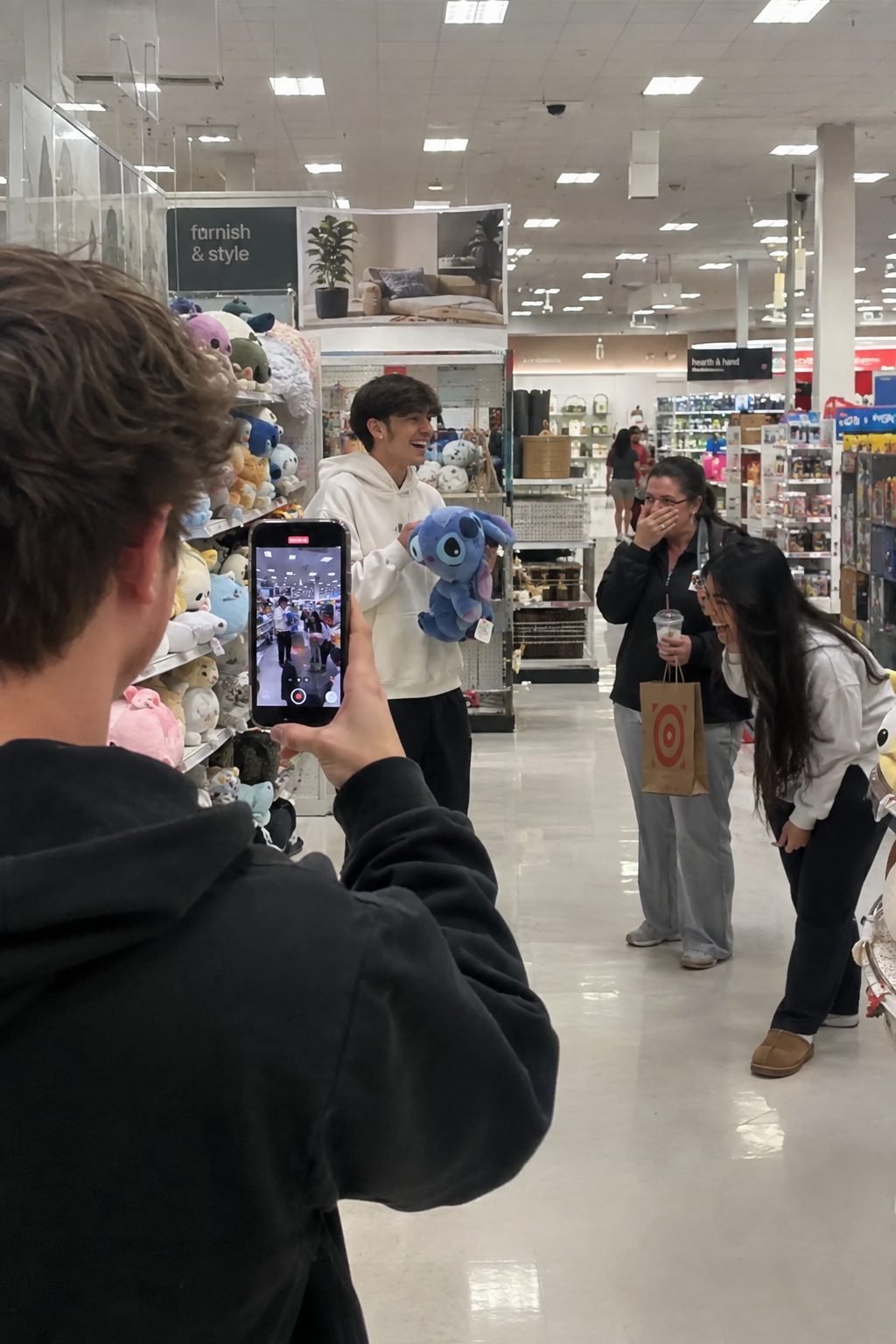A creator filming a product pickup video inside a Target store